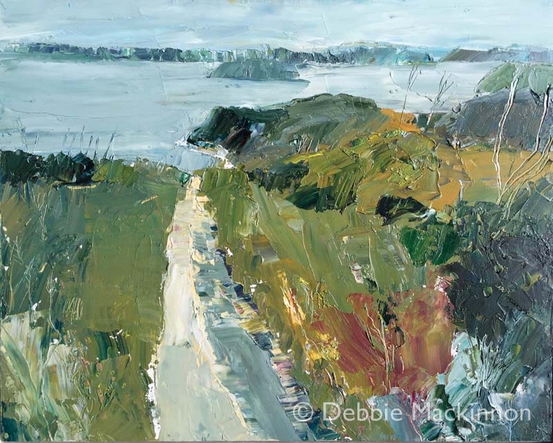 PATH TO THE SEA is a landscape painting by Debbie Mackinnon with deep green grass, a sand path, trees and distant rocks and blue sky above