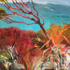 Abstract orange and pink shrubs and foliage with a single bent tree and bright blue sky above