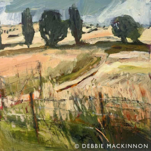 Yellow fields with a fence in the foreground and abstract green trees and sky in the distance