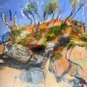 Orange and yellow rocks with green trees at the top. The trees are pointing up towards the blue sky.