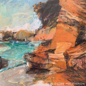 Abstract image of orange rocks with a blue ocean with waves and sea spray