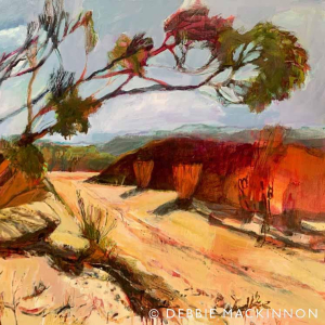 Abstract orange yellow landscape with orange rock formations and bent gum trees. A grey pink sky above with some white clouds