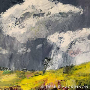 Yellow landscape with a stormy grey sky above with large white storm clouds. A single tree sits on the landscape.