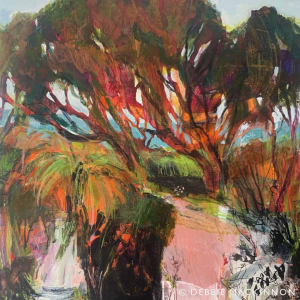 Abstract orange and green gums trees with a blue ocean peeking through the trees and colourful foliage in the foreground