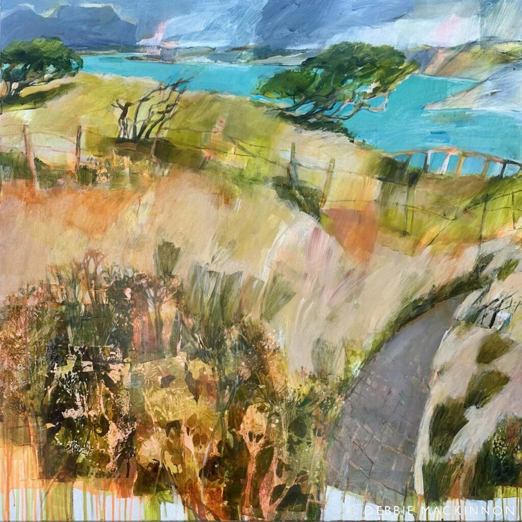 Abstract landscape painting showing a winding path, grassy hills, scattered trees, and a bright blue body of water under a cloudy sky. Green, blue, and earthy tones are prominent throughout the scene.