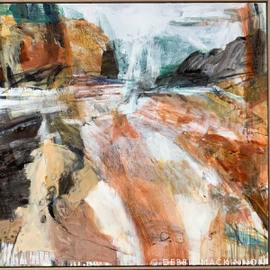 Abstract orange and grey white rocks with a blue ocean with waves and sea spray